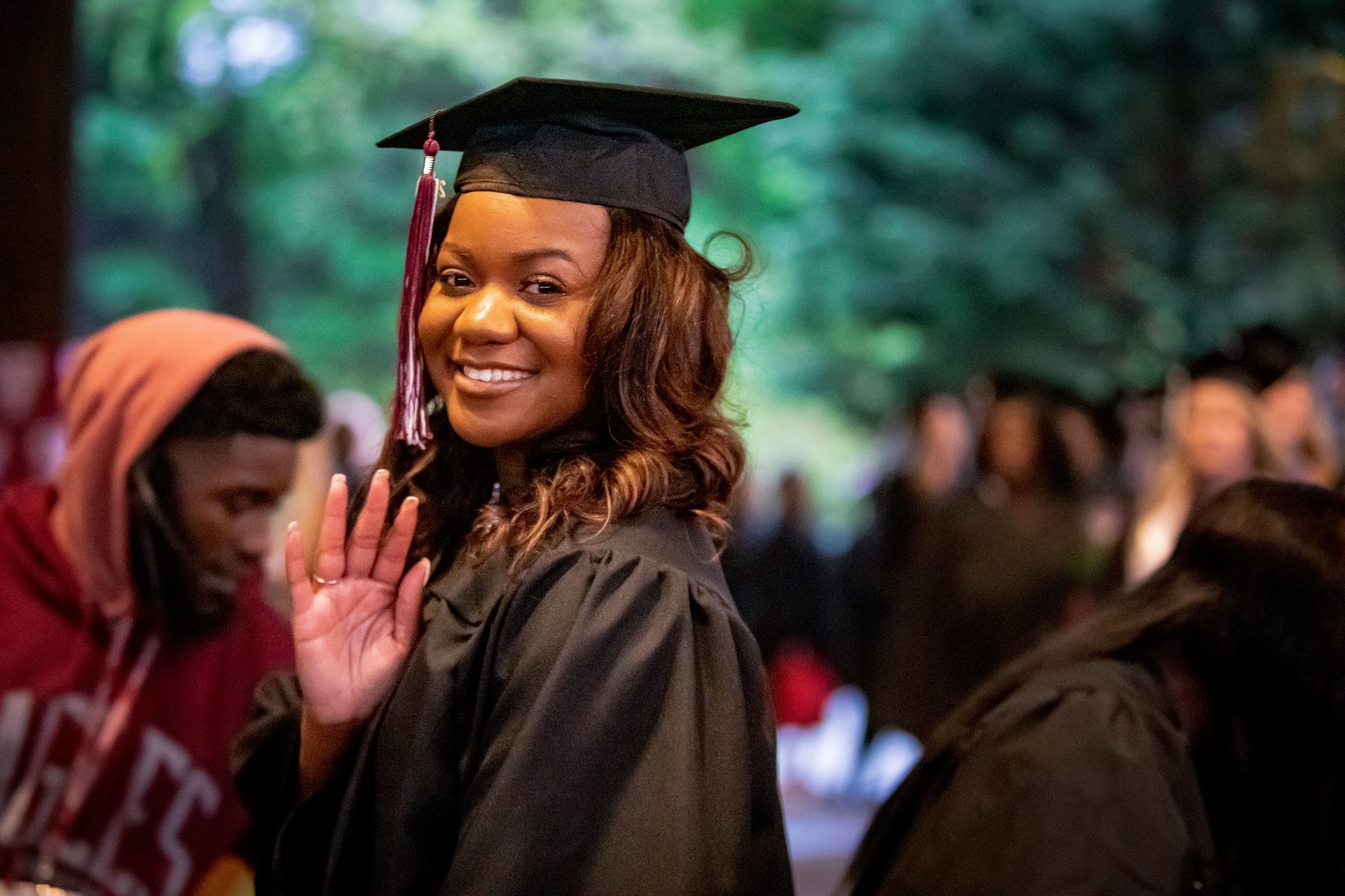 woman in cap and gown / graduation garb